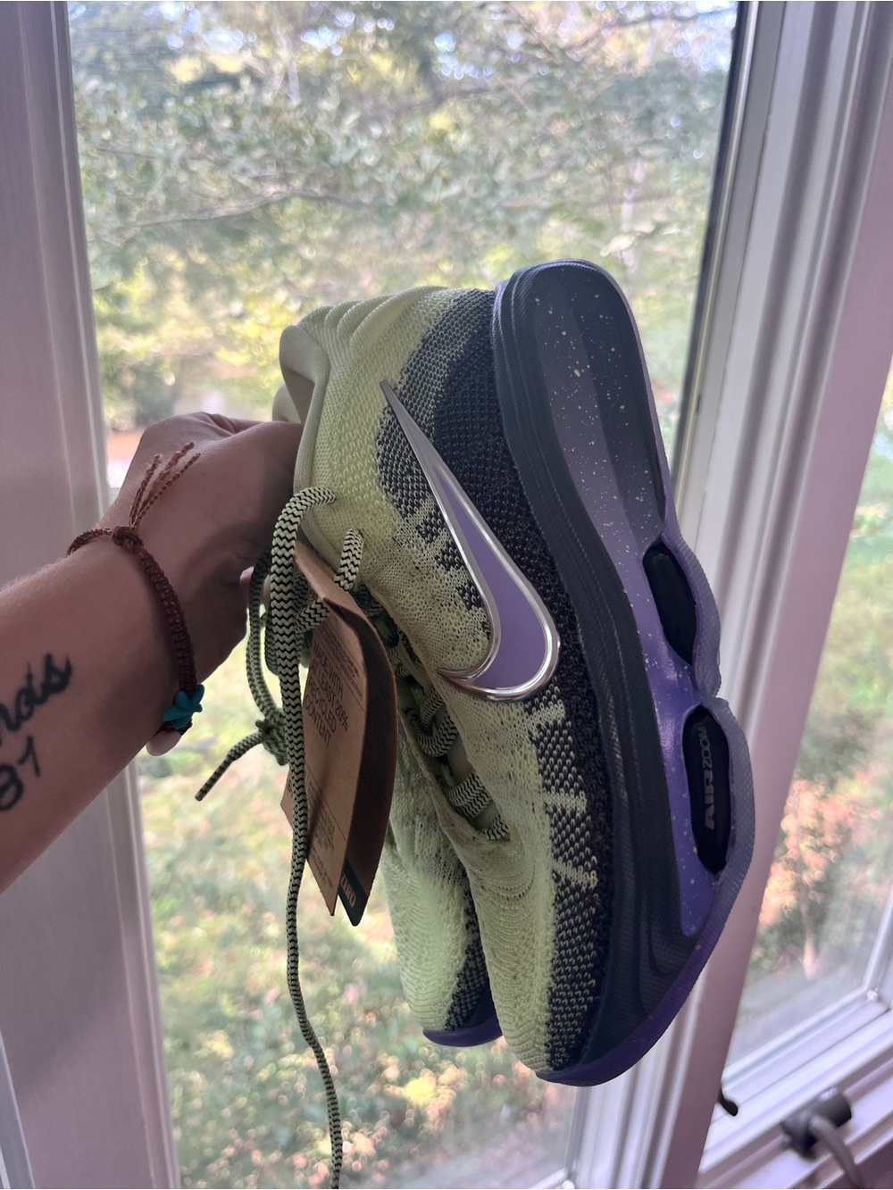 Nike Women’s Lime Green and Purple Flyknit Running Shoe